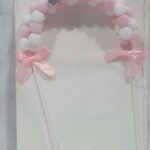 Toper arco de pompones rosa y blanco